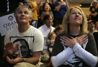 Scott and Karen McKinley react to the broadcast of Barack Obama speaking in Chicago on the election night at Westin Hotel in Seattle Tuesday.