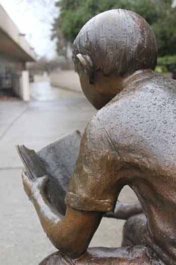 The statue at the downtown library was covered in rain this past week.