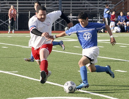 Hazen's Jonathan Bentancourt brings the ball up the field against Renton April 21.