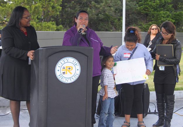 Dr. Linda Smith smiles as Mirna Montano speaks about how the Center helped her and her children