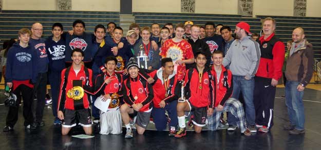 Members of the Lindbergh and Renton wrestling teams pose for a photo following the River Ridge Rumble.