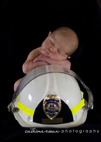 Bo Van Hoof posed on his grandfather’s fire helmet as one of his newborn photos.