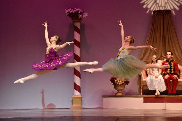 Dancers leap into the air during a performance of 'The Nutcracker.'