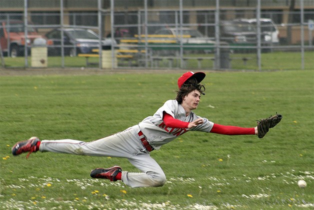 Renton infielder Michael Weaver dives for a ball against Lindbergh May 3.