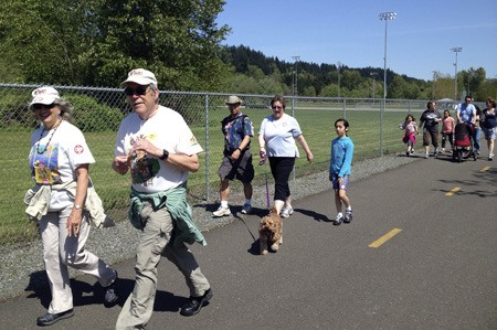 Dozens of walkers raised about $23