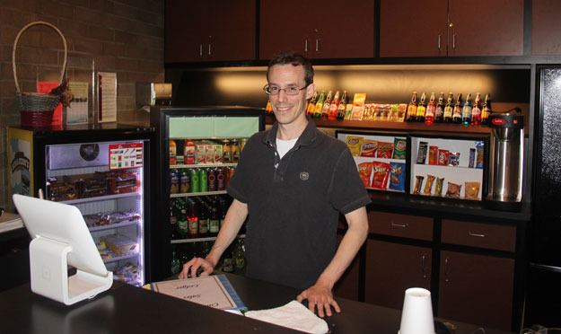 Jonathon Crick of Puget Sound Access stands in Carco Theatre’s new concessions stand.