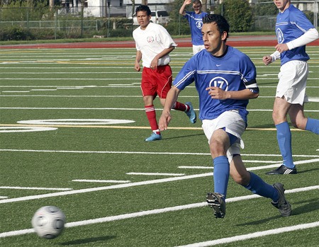 Hazen's Israel Padilla dribbles past Renton defenders.