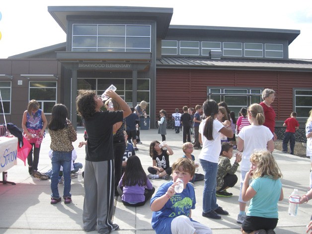 Thirsty students take advantage of water during a recent walk-a-thon at the re-newly constructed Briarwood Elementary School in East Renton.