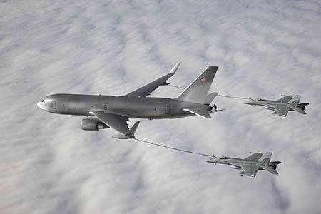 The NewGen Tanker demonstrates its ability to simultaneously refuel two F/A-18 Super Hornet aircraft from the wing air refueling pods.