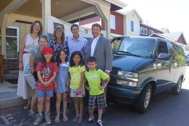 King County Councilman Reagan Dunn poses with Vision House staff members and kids