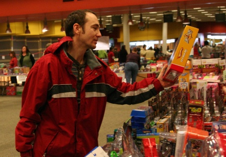 Sergin Midrigan looks at a Hot Wheels set at the Renton Salvation Toy-N-Joy distribution Dec. 22. The drive provided about 1