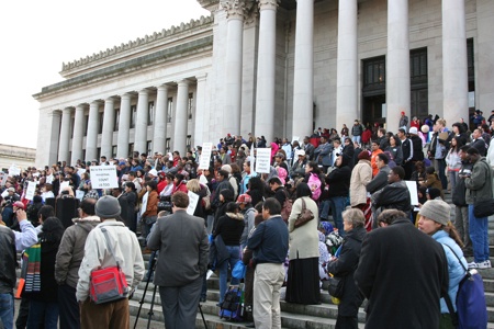 Legal immigrants and refugees from Washington state rallied in Olympia Tuesday