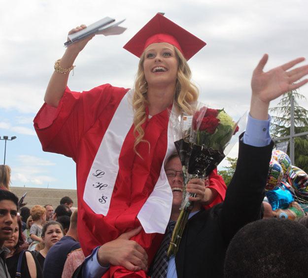 Graduates and families celebrated outside the ShoWare Center in Kent following the Lindbergh High School 2015 commencement ceremony Friday.