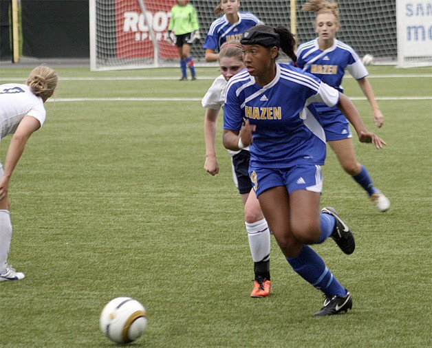 Hazen's Tyra Markey dribbles away from a Kennedy Catholic defender Sept. 13.