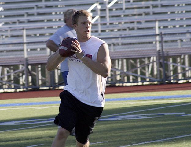 Liberty’s Trey Wheeler lines up a pass against Issaquah during a 7-on-7 drill July 6 at Liberty.