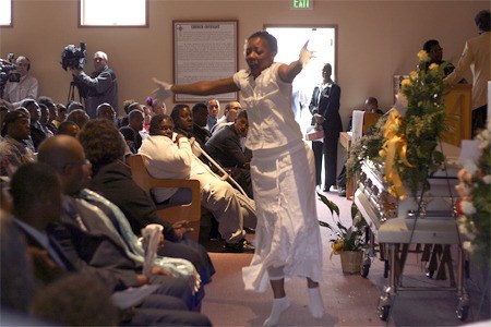 Fuhyda Rogers performs a praise dance at the Celebration of Life Monday to remember Alajawan Brown