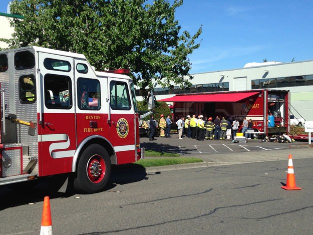 Firefighters prepare to enter a Boeing building in which a Hazmat alarm sounded Thursday morning.