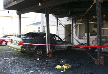 A fire at 135 Park Ave. N. consumed this Lexus and offices in the upper floor Tuesday night.