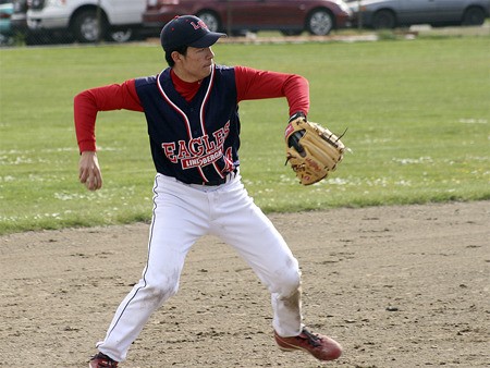 Lindbergh's Tommy Kawamura fields a ground ball and throws to first during the Eagles' 18-2 win against Renton Wednesday.