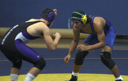 Hazen’s Pedro Trujillo squares off against a Foster wrestler Dec. 17.