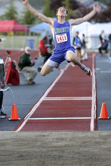 Liberty's Josh Gordon leaps in the long jump. Gordon won a 3A state title in the event.