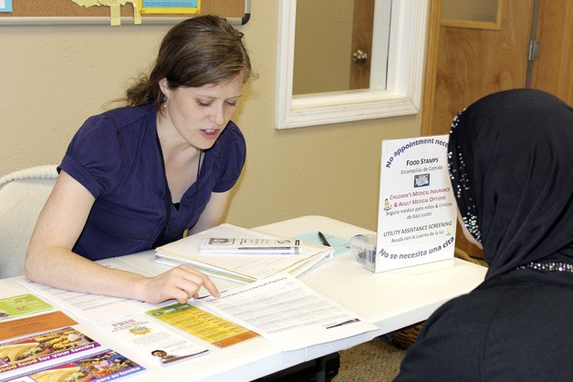 Erin Milliren of the United Way of King County’s Bridge to Basics Program connects an interested client to community resources and assistance.