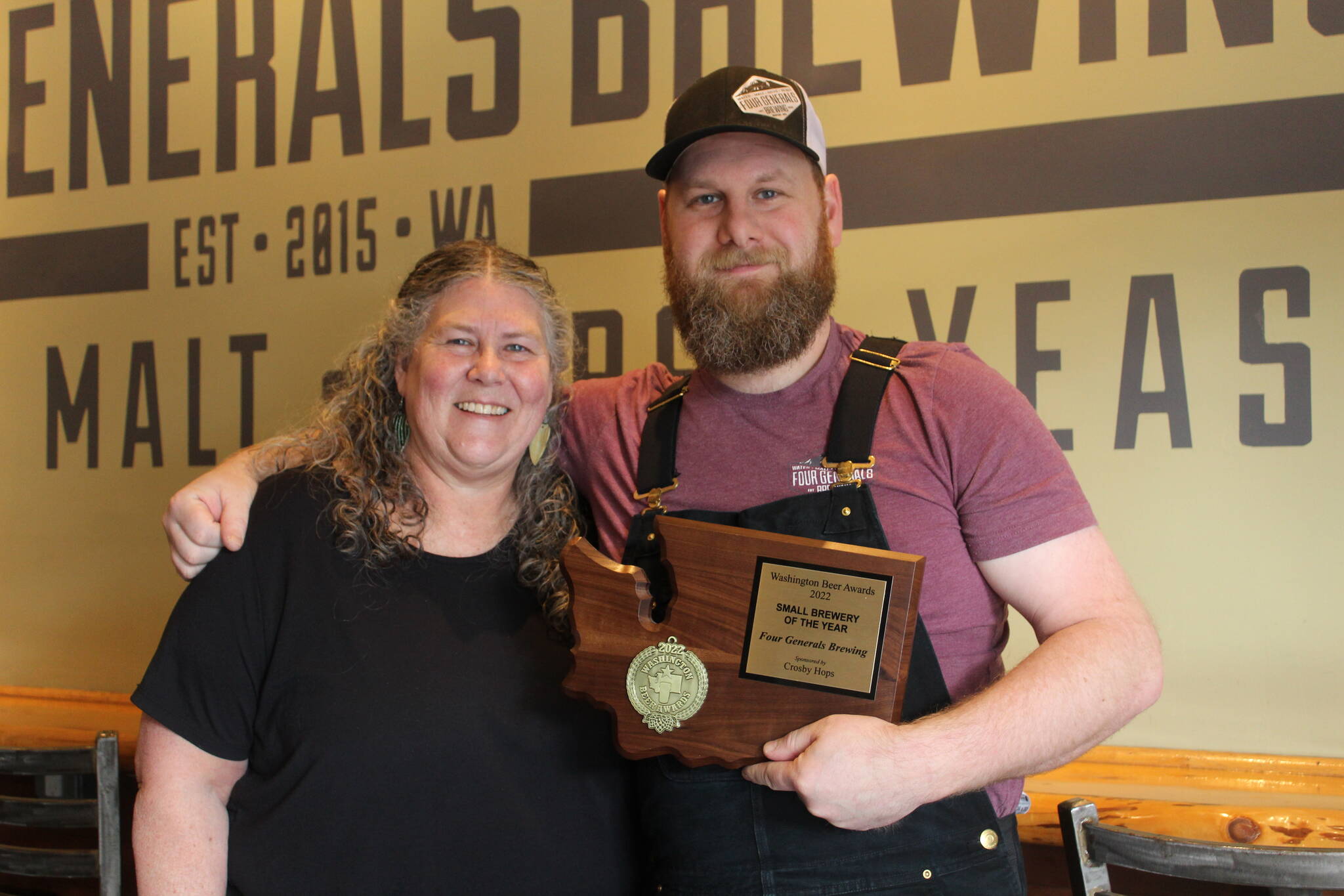 Four Generals co-owners and mother and son Mary Hudspeth and Ross Hudspeth pose with their “Small Brewery of the Year” plaque. Bailey Jo Josie / Renton Reporter