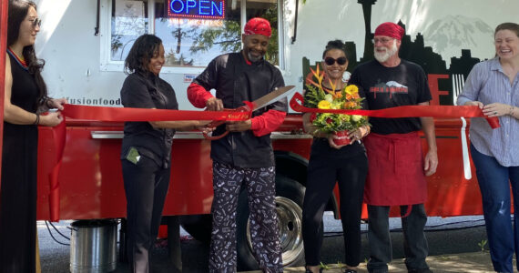 The Soul Fusion food truck is now officially open for business. The “down home soul food” experience is now available wherever in Renton the truck may be parked. For the truck’s ribbon cutting ceremony on Friday, June 23, the top-selling item on the menu was the Catfish Sandwich Combo, which Renton Reporter’s advertising representative Sianna Foster reports was “soul’d out” before she even arrived to the ceremony. Foster had the Fusion Burger, which she says was “so good I couldn’t stop eating it even though my body begged me to stop.” Visit soulfusionfood.com to learn where the truck will be next. (Photo by Sianna Foster/Renton Reporter)