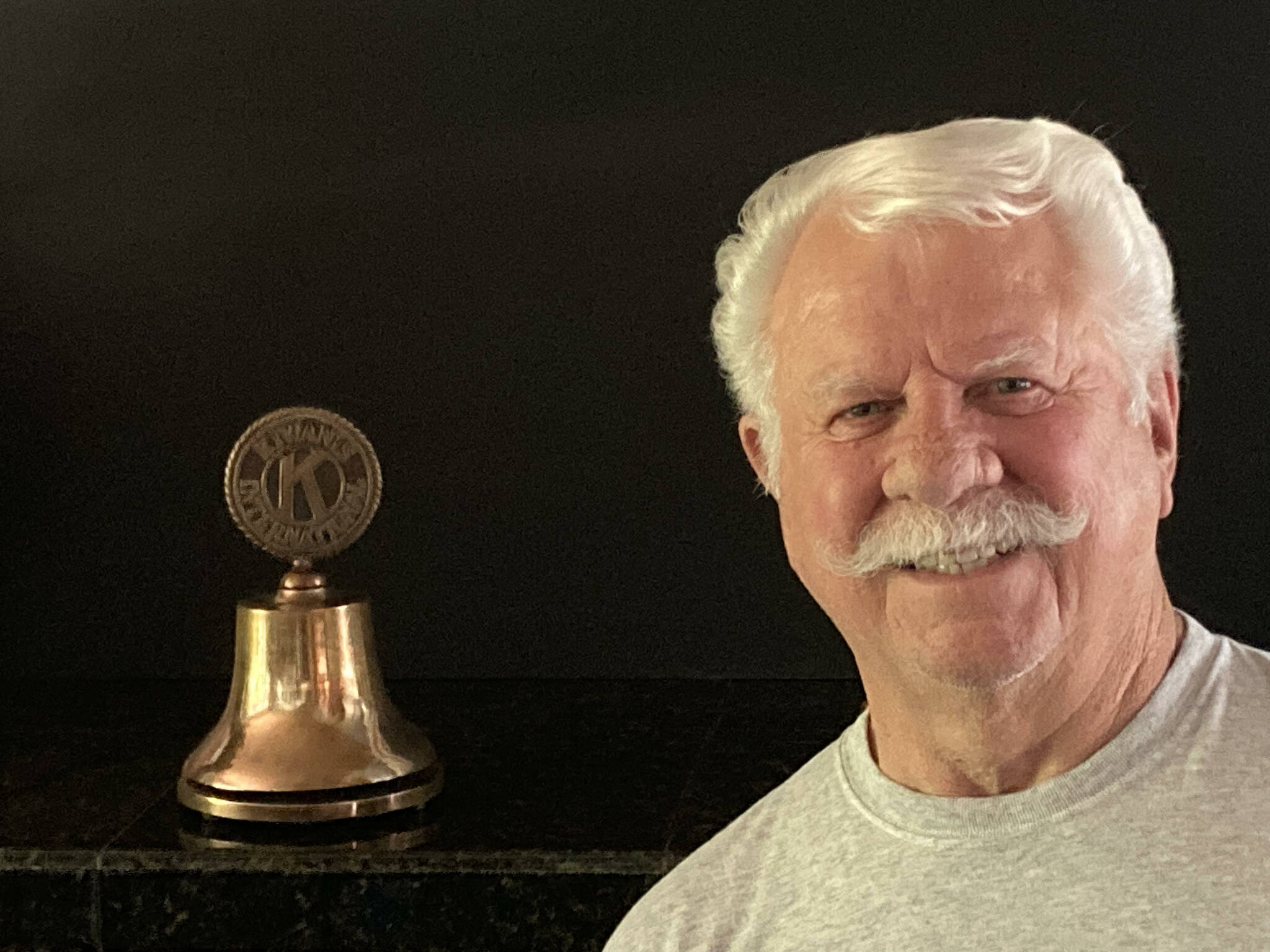 The Kiwanis Club of Renton is donating its gavel and Kiwanis Bell, pictured here with club president Jon Pozega, to the Renton History Museum. (Courtesy photo)