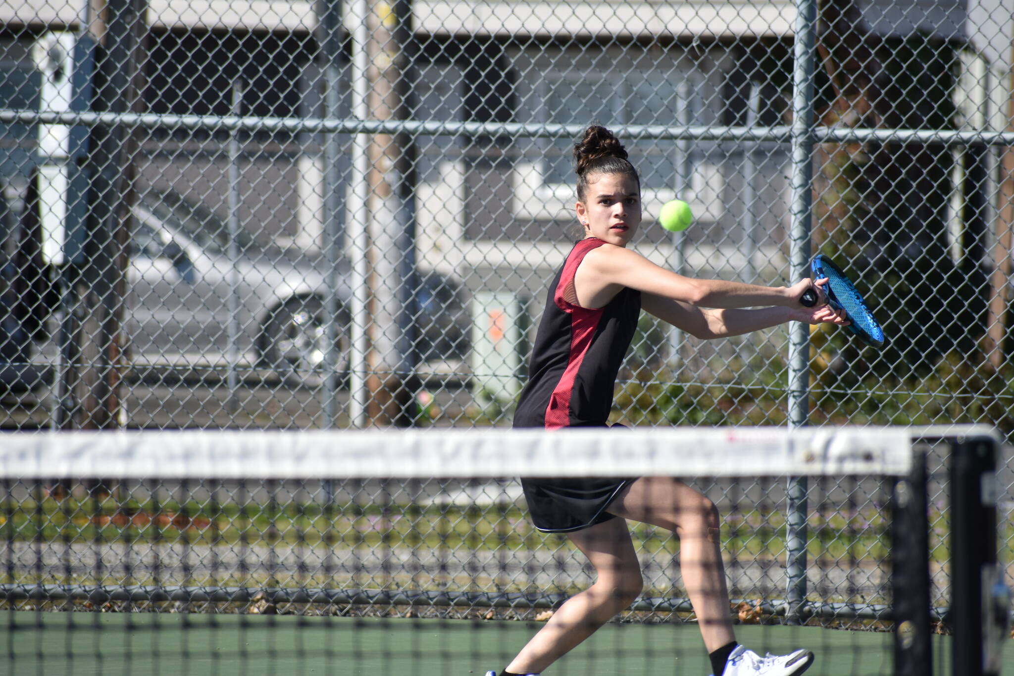 Renton’s Michelle Arjona-Reyes lines up a backhand shot against Hazen. Ben Ray / The Reporter