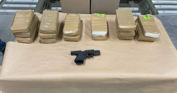 Law enforcement seized more than 15 kilograms of fentanyl powder and a firearm from the suspects’ vehicle on May 9. Agents seized an additional kilogram of fentanyl powder in the search of an apartment of one of the suspects living in Renton. (Courtesy of the Department of Justice.)