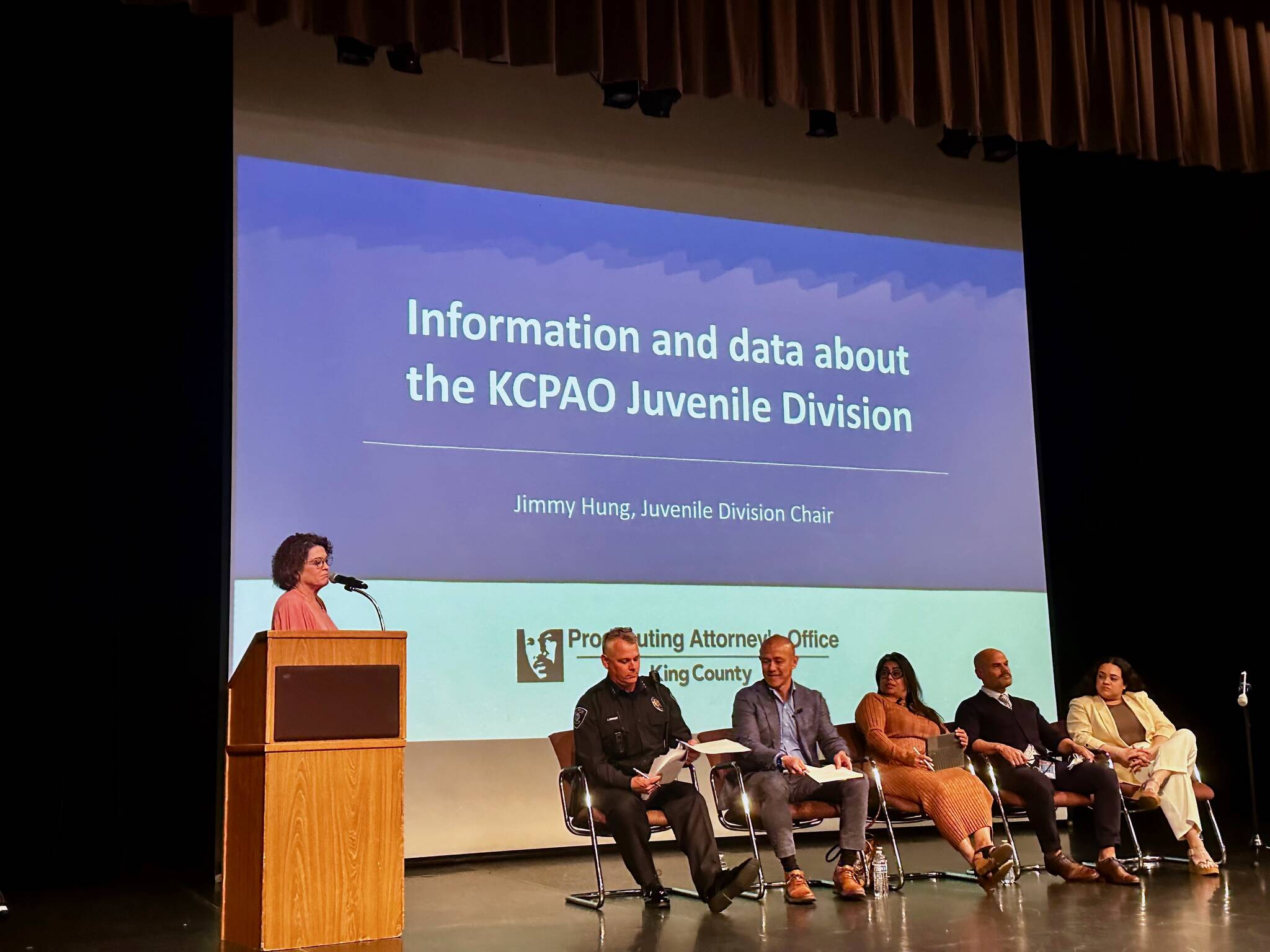 Renton Police Department’s Meeghan Black speaks at the 2024 community safety forum with (from left) Chief Jon Schuldt, Jimmy Hung, Veronica Galván, Randy Matheson and Katya Wojcik. Photo by Joshua Solorzano/The Reporter