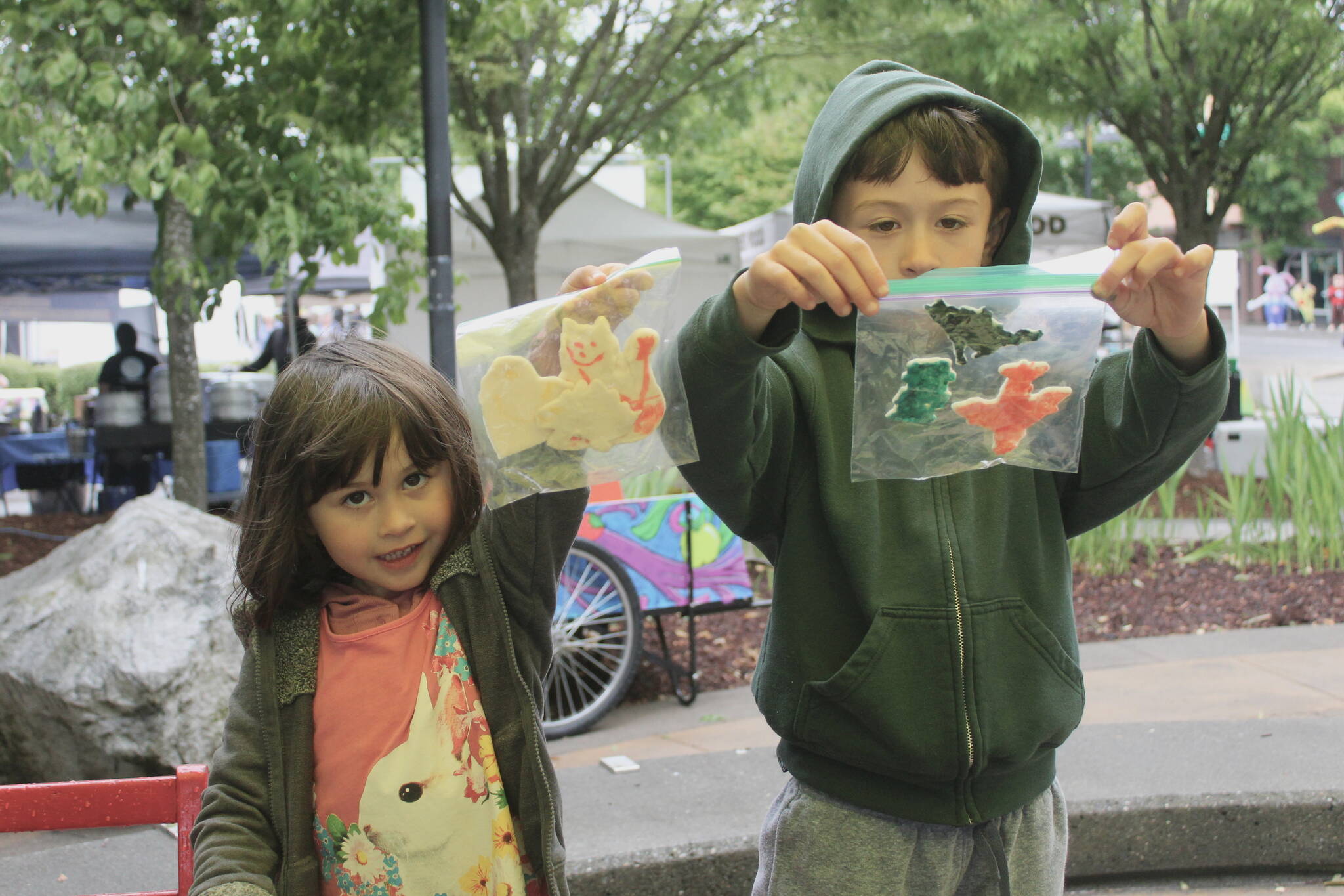 Nova and Matteo show off their crafts that they had made at the Kid’s Patch tent at the Renton Farmers Market. Photos by Bailey Jo Josie/Sound Publishing