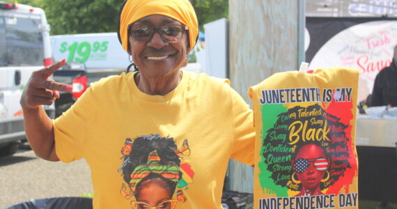 Elenor of Northington Tees shows her Juneteenth merchandise. Photo by Bailey Jo Josie/Sound Publishing