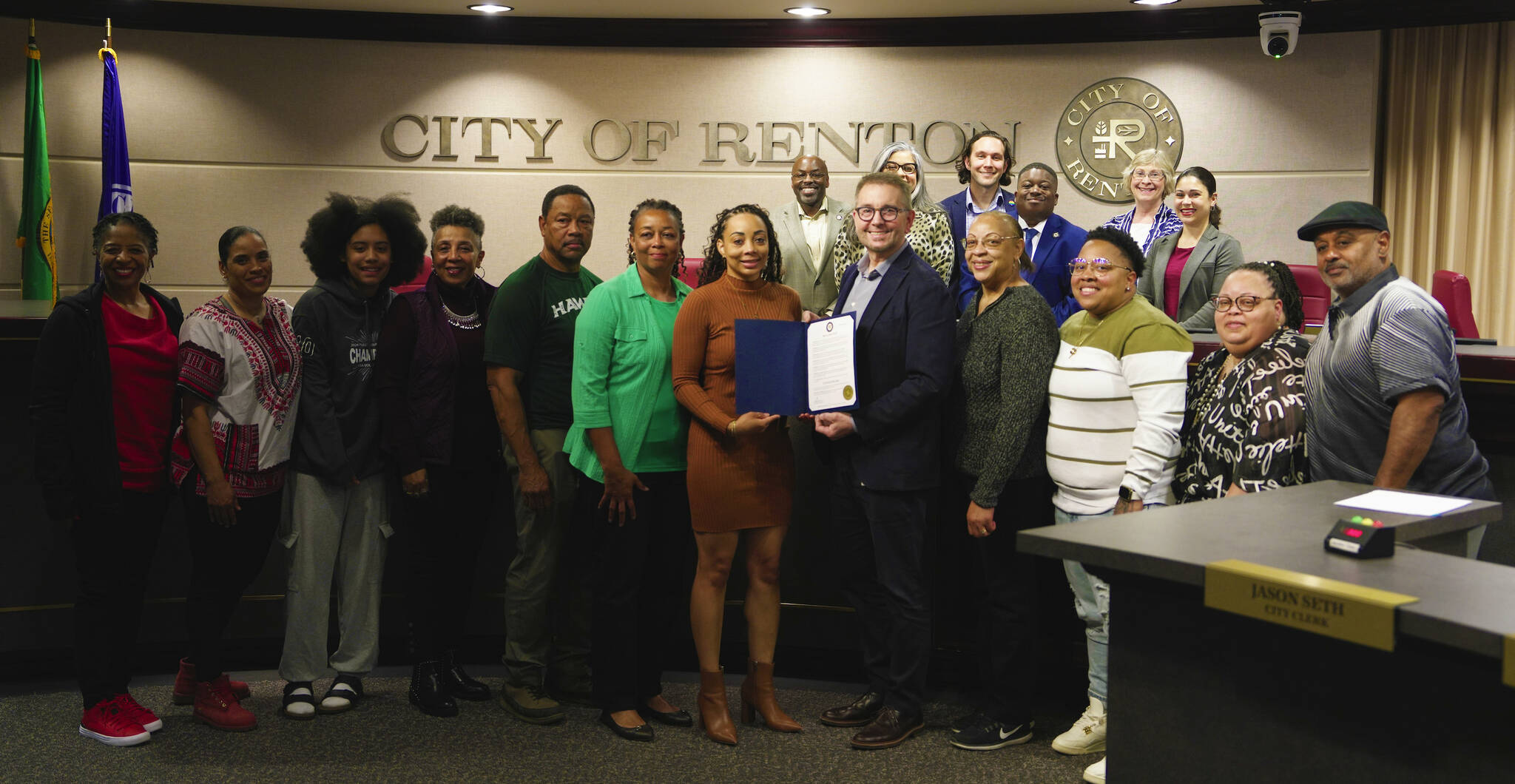 Danielle Smith, others, and the Renton City Council posing for a photo with the Juneteenth proclamation. Photo courtesy of the City of Renton