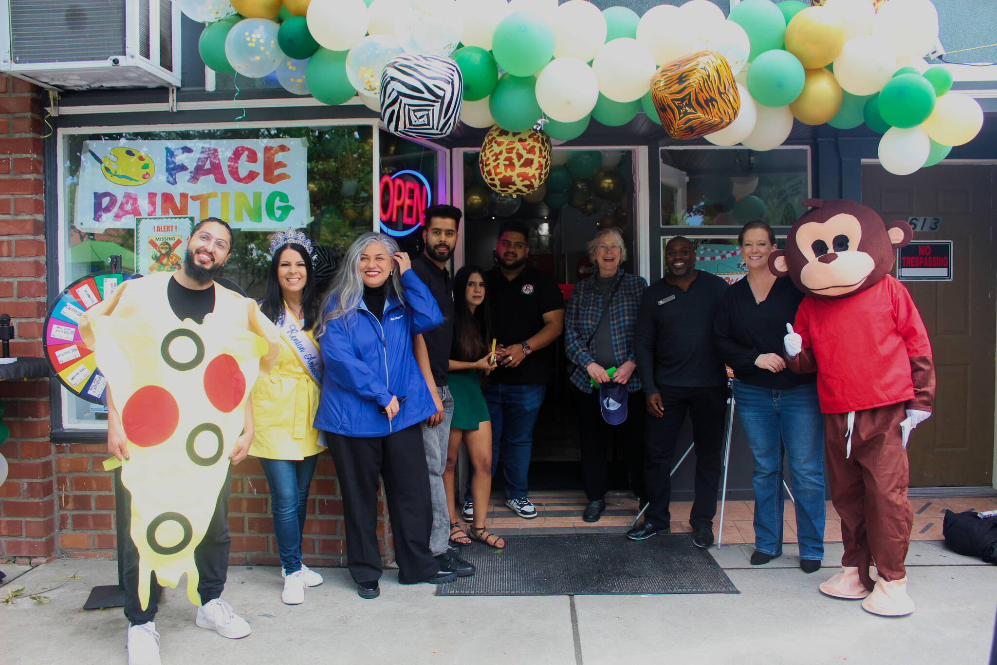 The Renton Chamber of Commerce and Renton City Council members celebrate Smoking Monkey Pizza’s 10-year celebration. Photo by Bailey Jo Josie/Sound Publishing.