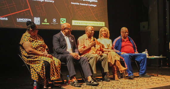 John Houston (center) speaks during a post-screening panel discussion for the “King County Reparations Project.” Pictured left to right: Stephanie Johnson-Tolliver, President of the Black Heritage Society of Washington State; Seattle Central College professor Rev. Carl Livingston; Houston; Director Angela Moorer; Former King County Councilmember Larry Gossett. Photo by Bailey Jo Josie/Sound Publishing