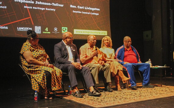 John Houston (center) speaks during a post-screening panel discussion for the “King County Reparations Project.” Pictured left to right: Stephanie Johnson-Tolliver, President of the Black Heritage Society of Washington State; Seattle Central College professor Rev. Carl Livingston; Houston; Director Angela Moorer; Former King County Councilmember Larry Gossett. Photo by Bailey Jo Josie/Sound Publishing
