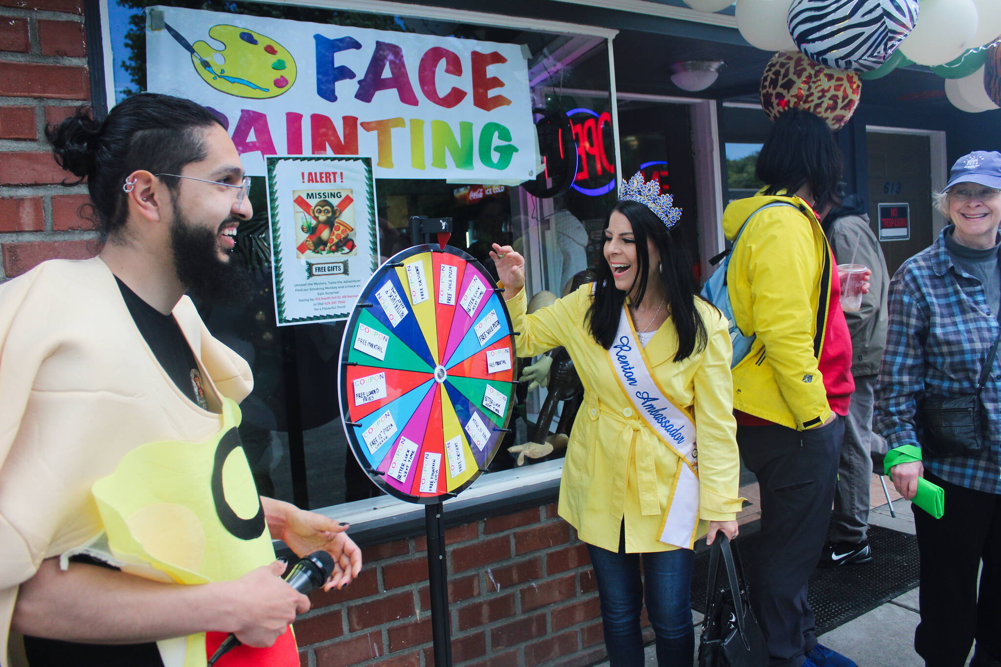 Mrs. Renton Ambassador Jennifer Brothers spins the wheel outside Smoking Monkey Pizza. Photo by Bailey Jo Josie/Sound Publishing