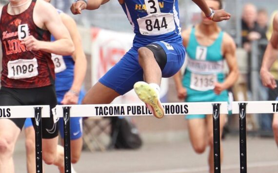 Kenyon Andrews in mid-air on his way to a state title. Photo provided by Keith Baker/ Instagram: KeithBakerLXVI