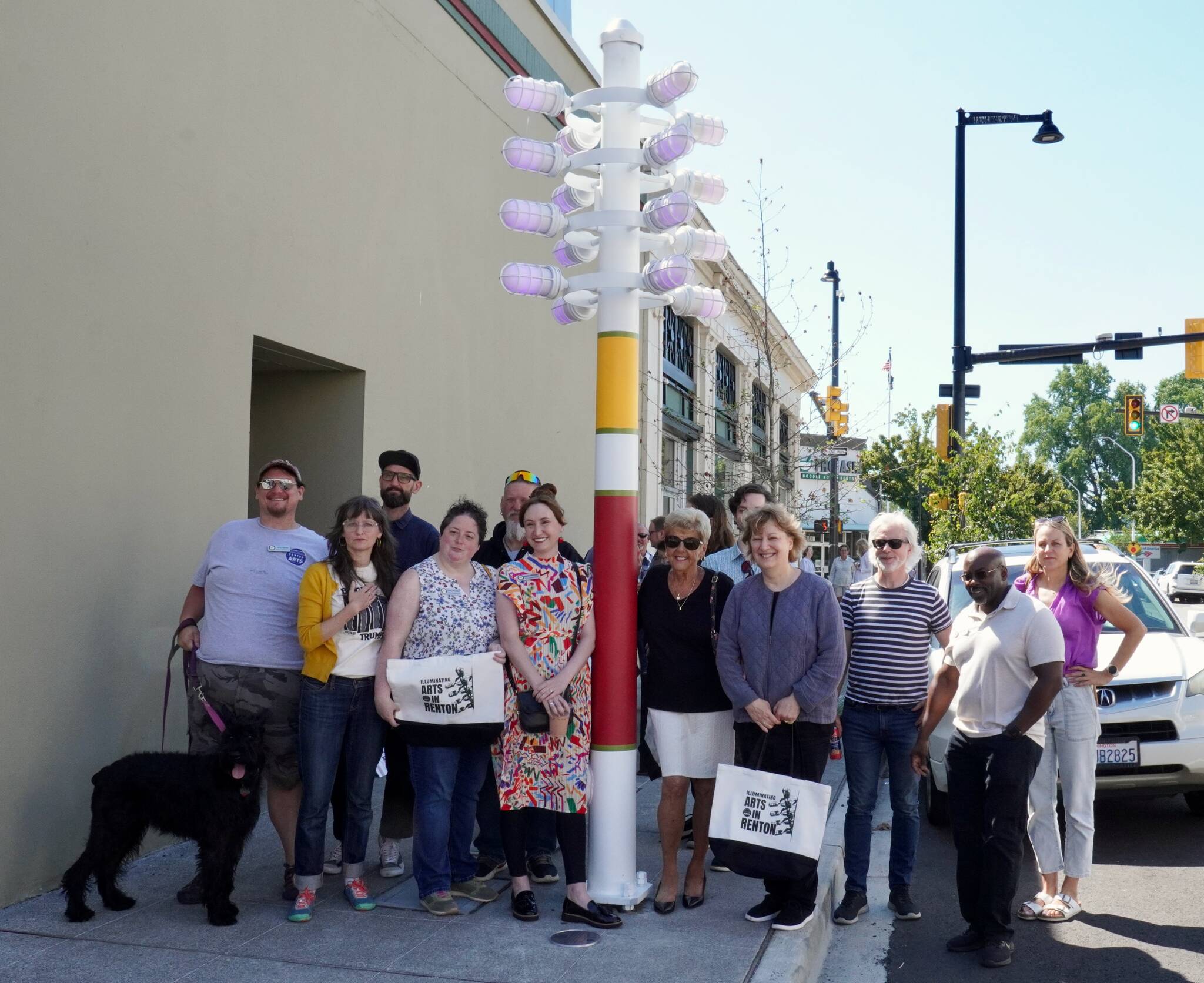 Renton Arts Commission members, various Renton employees, and a few council members gathered around the renewed streetlight. Photo by Joshua Solorzano/The Reporter