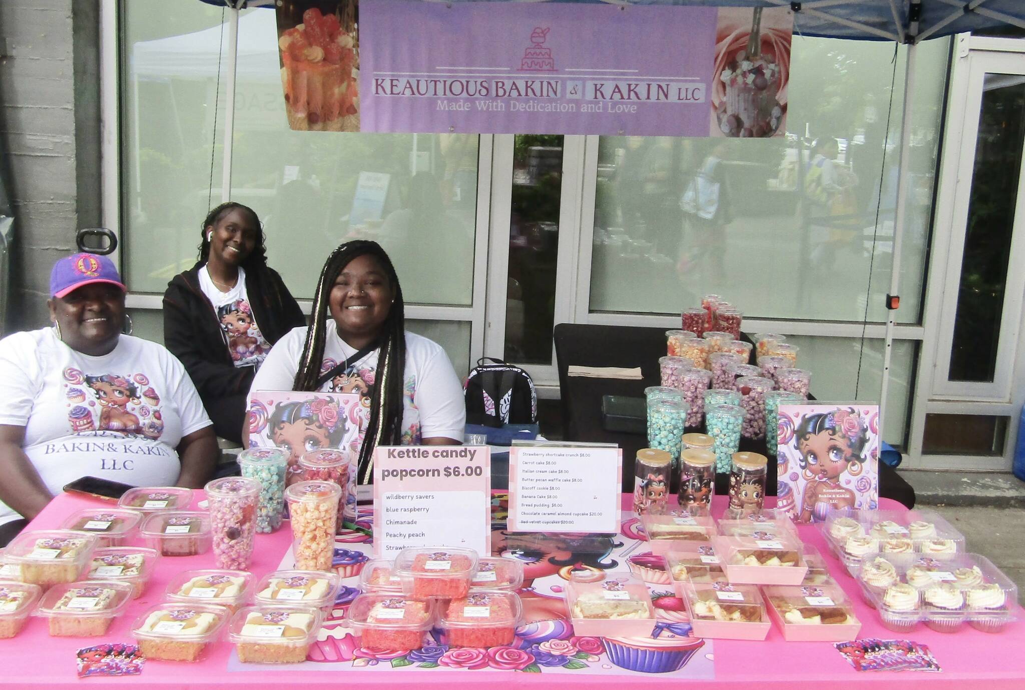 From left to right: Ashley Scott and her daughters Sandria and KJ Scott at the Keatious Bakin & Kakin LLC booth. Photo courtesy of Annika Hauer