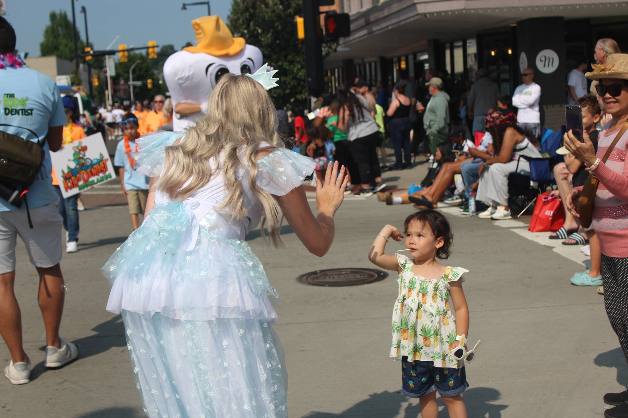 The tooth fairy gives a high five at the 2024 Renton River Days Parade. Photo by Bailey Jo Josie/Sound Publishing.