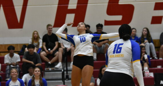 Arisa May-Kelly for Hazen leaps for a spike attempt. Ben Ray / The Reporter