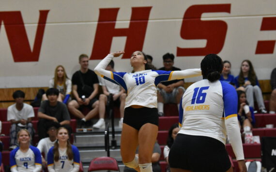 Arisa May-Kelly for Hazen leaps for a spike attempt. Ben Ray / The Reporter