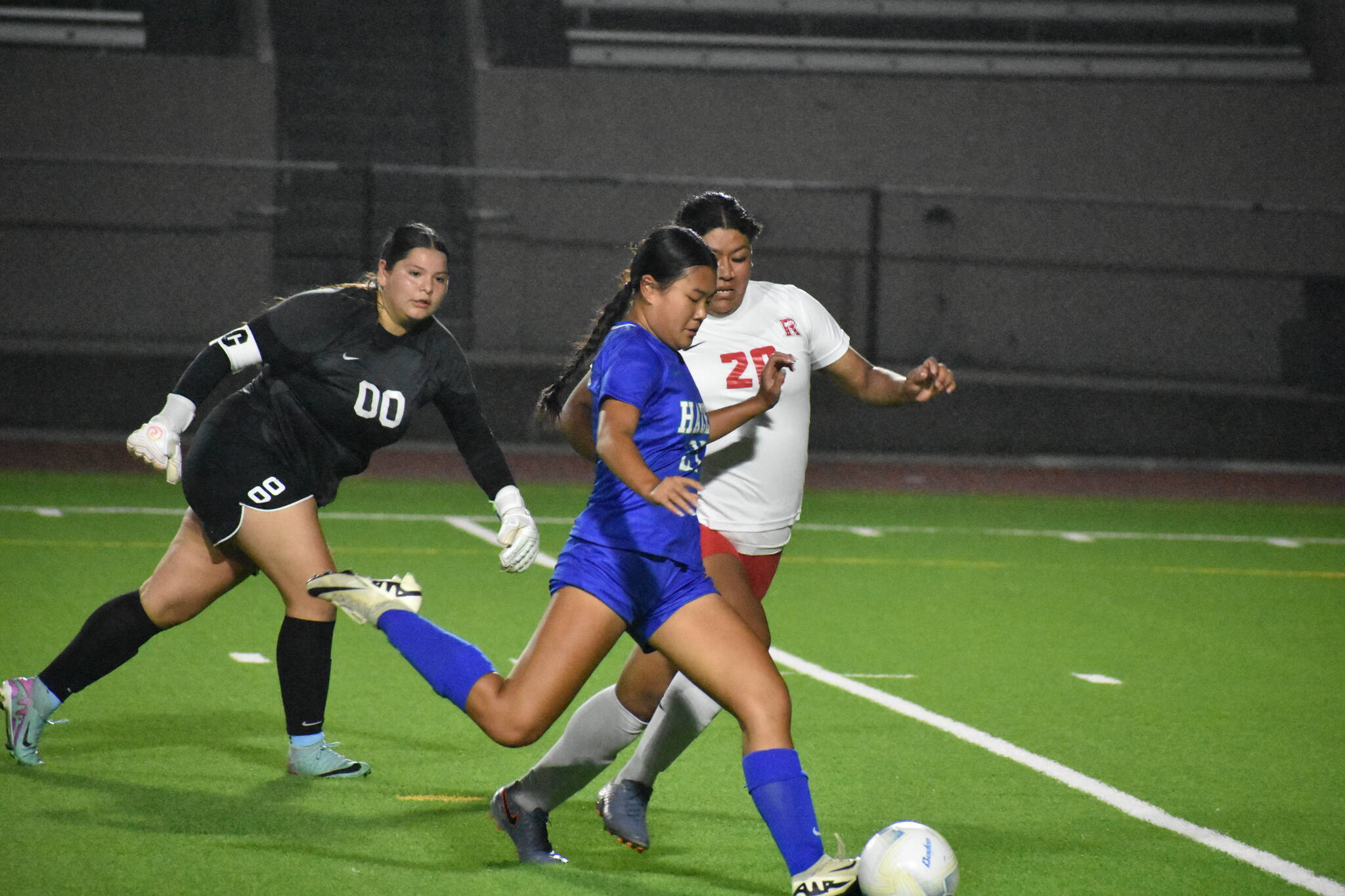 Zoe Wong out-flanks the Renton keeper to score her second goal of the game. Ben Ray / The Reporter