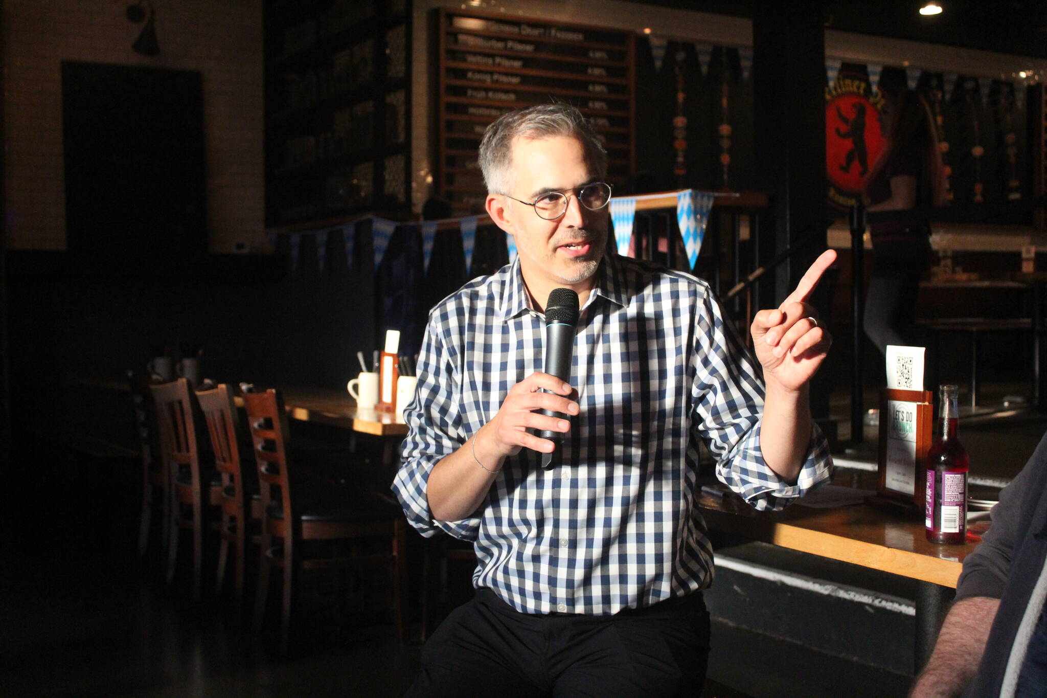 Vision House Executive Director Derek Sciba talks about the work Vision House does to help unhoused families in Renton and King County. Sciba was the guest speaker at the first Renton Reporter Read-All-About-It on Monday, Sept. 23. Hosted at Berliner Pub in downtown Renton, the event allowed local readers to meet and chat with Renton Reporter staff while enjoying some food and drink. Photo by Bailey Jo Josie/Sound Publishing