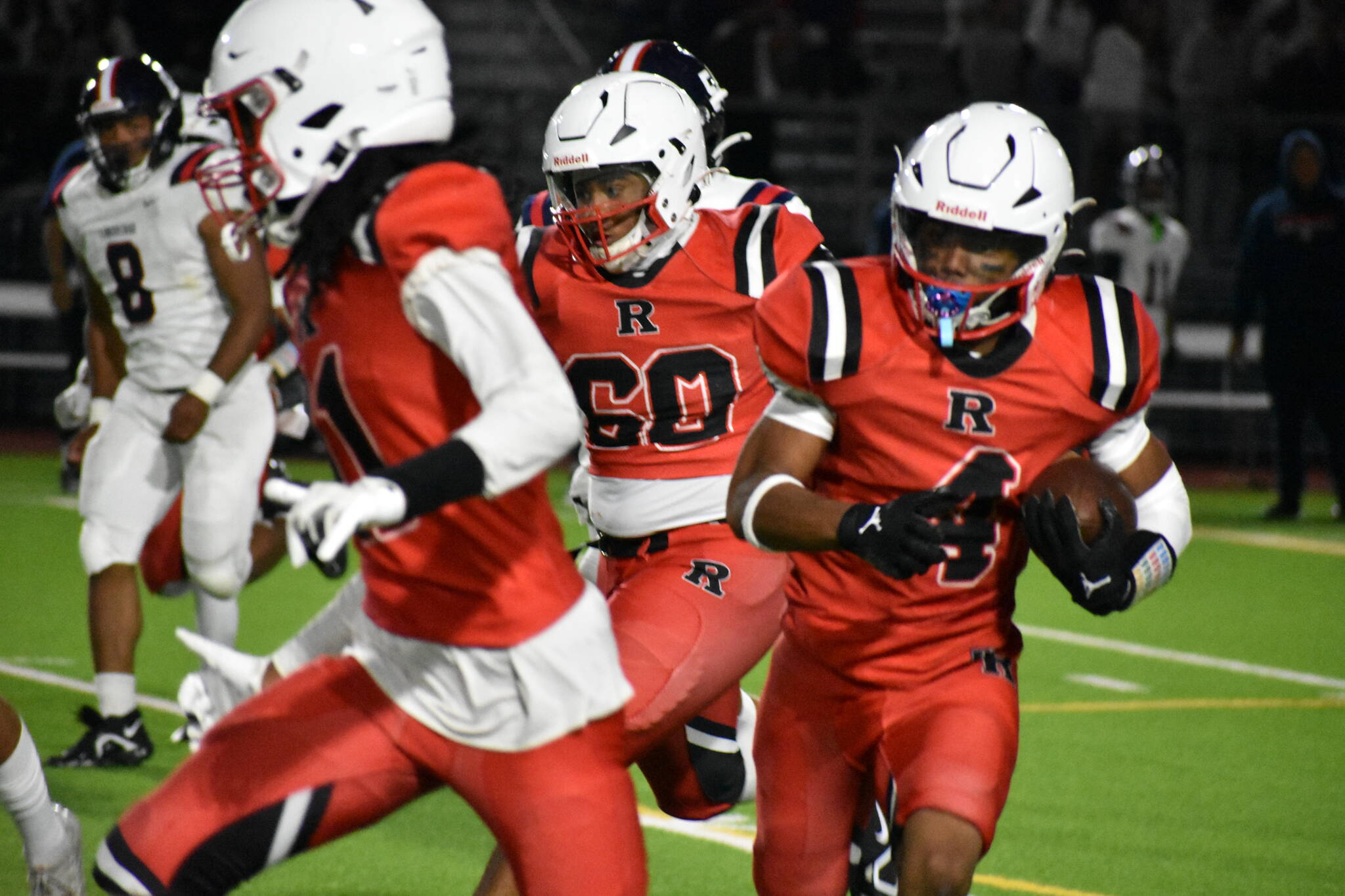 Renton junior Major Bloodsaw runs the ball with blockers in front. Ben Ray / The Reporter