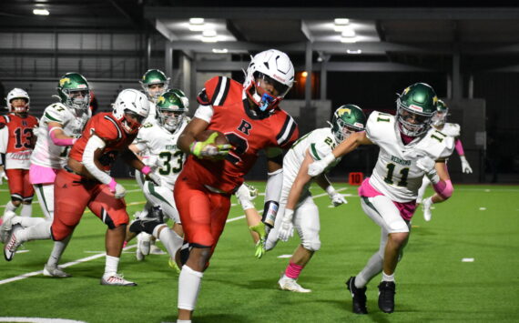 Major Bloodsaw runs through the Redmond defense for a touchdown. Ben Ray / The Reporter