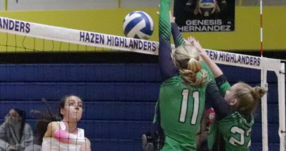 After a blazing spike from Jaesi Hayes, Woodinville volleyball blocks the ball back into the Hazen side. Photo provided by Tyler Rubenstein